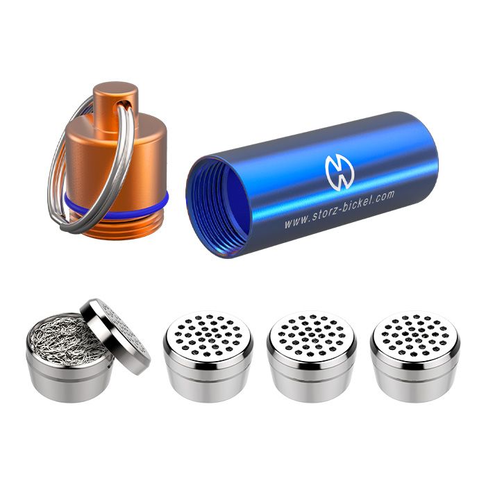 Blue Capsule Caddy lying on its side with its cap and four dosing capsules beside it