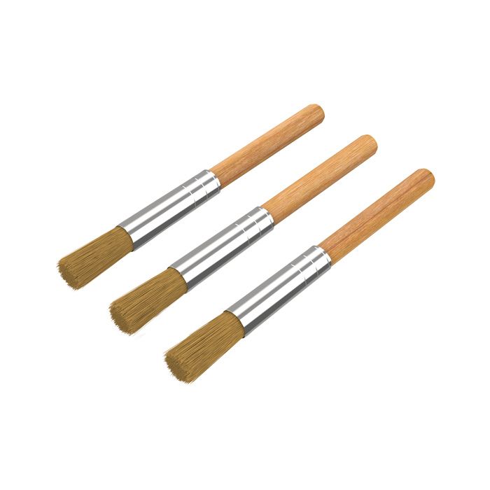 Three Storz & Bickel cleaning brushes arranged diagonally on a white background