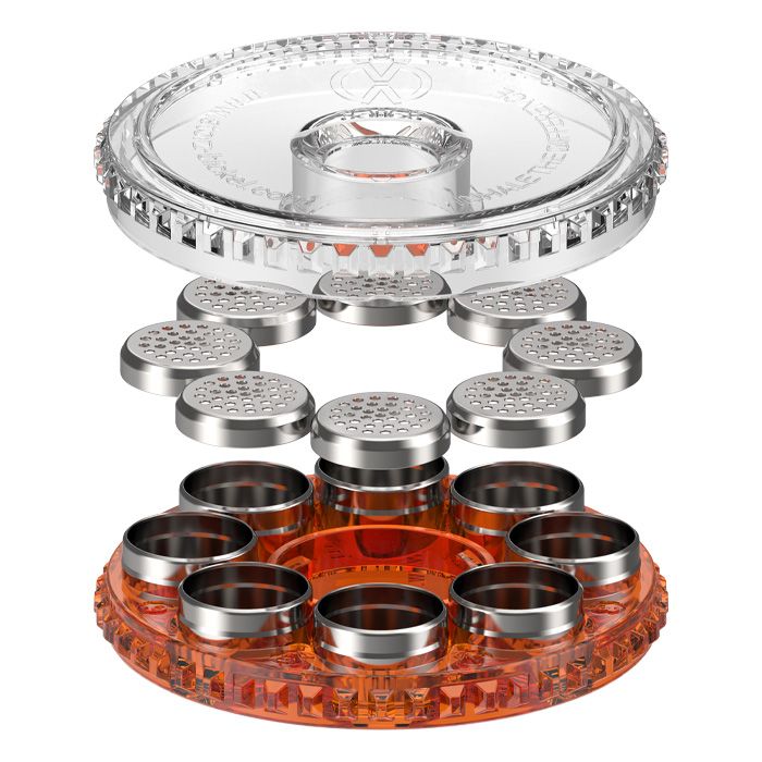Front view of the open Dosing Capsule Magazine showing the lid and capsule holders