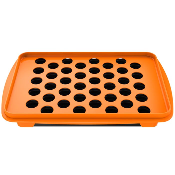 Top view of the orange filling tray showing its capsule openings
