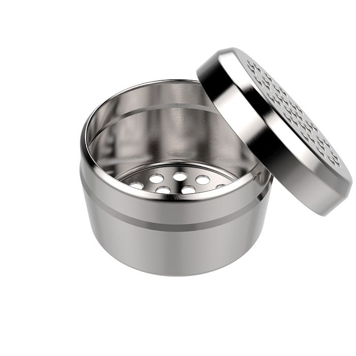 Storz & Bickel silver dosing capsule open, with the lid resting beside it
